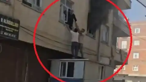 Bismil'de 3 Katlı Binada Yangın: Mahsur Kalan Kadın Konteyner Üzerinden Kurtarıldı