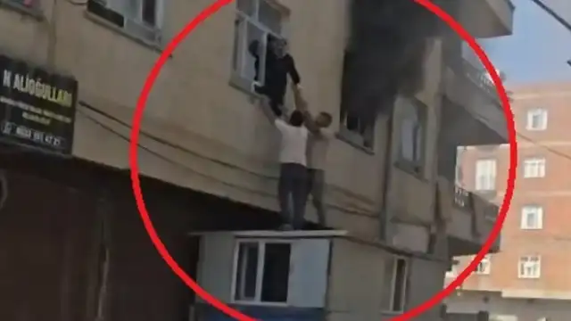 Bismil'de 3 Katlı Binada Yangın: Mahsur Kalan Kadın Konteyner Üzerinden Kurtarıldı